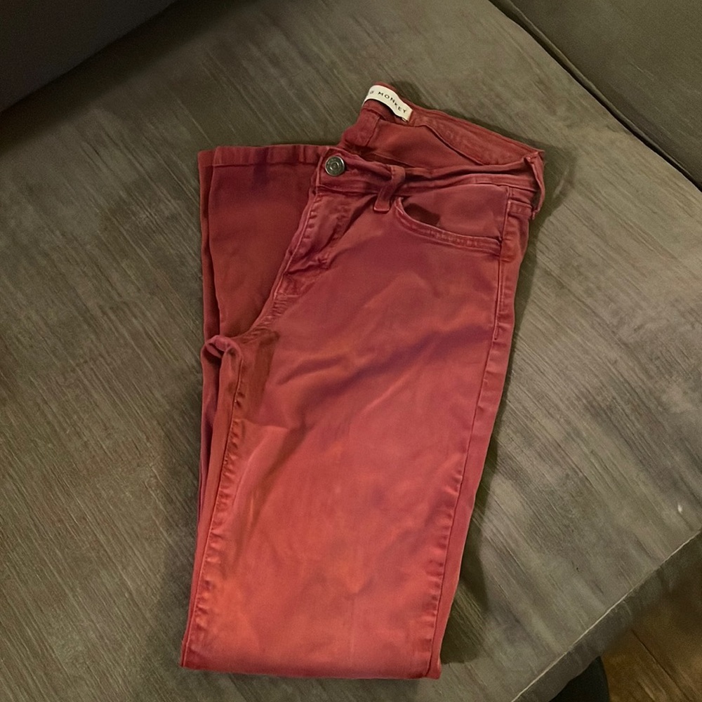 Red colored skinned jeans